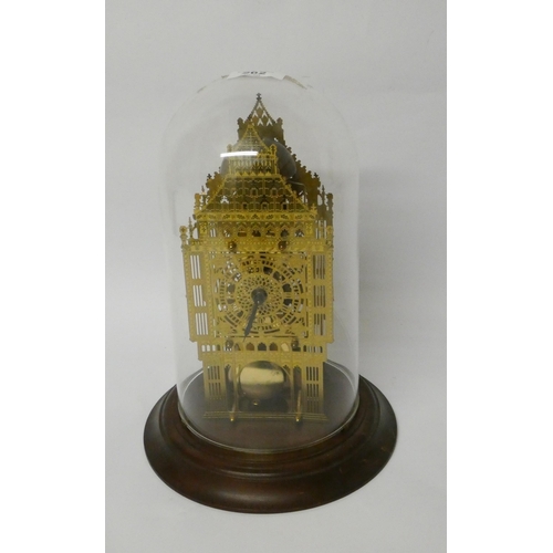 262 - An architectural style brass skeleton clock beneath glazed dome