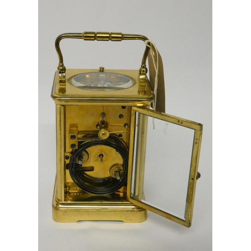 263 - A large brass repeater carriage clock, the white dial signed Dent, The Strand London, height with ha... 