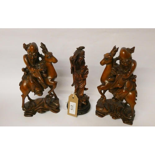 279 - A pair of Japanese root carvings of warriors mounted on deer and another carving of a sage on a circ... 