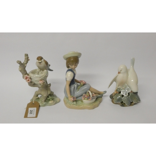 288 - Three pieces of Lladro - girl picking flowers and two bird figurines