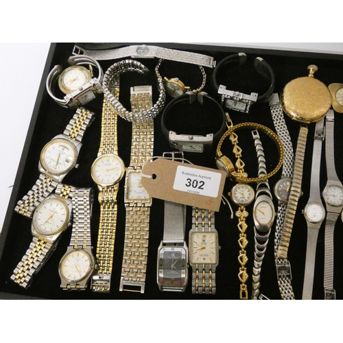 302 - A tray of assorted quartz ladies and gents wrist watches