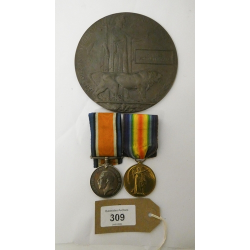 309 - A pair of first world war medals and death plaque awarded to O/583 Private Horris Postlethwaite of t... 