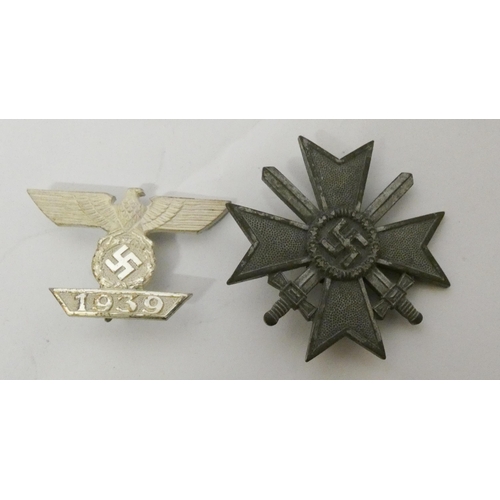 312 - Two boxed Nazi insignia -  the bar for the Iron Cross First Class World War II and the other War Mer... 