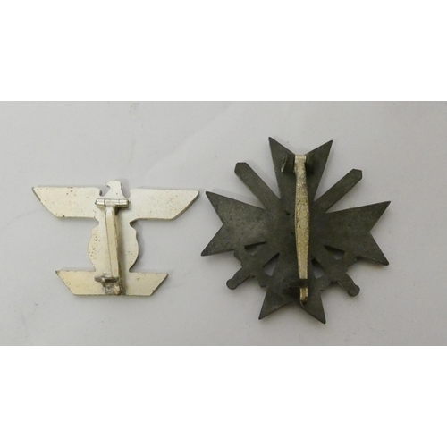 312 - Two boxed Nazi insignia -  the bar for the Iron Cross First Class World War II and the other War Mer... 