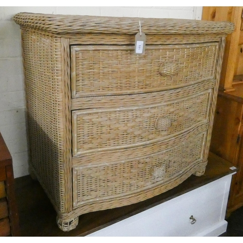 191 - A wicker work bow front chest of three drawers, 34