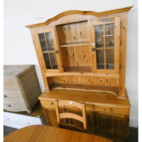 192 - A Pine dining room suite comprising oval table, four ladder back style chairs and a dresser with gla... 