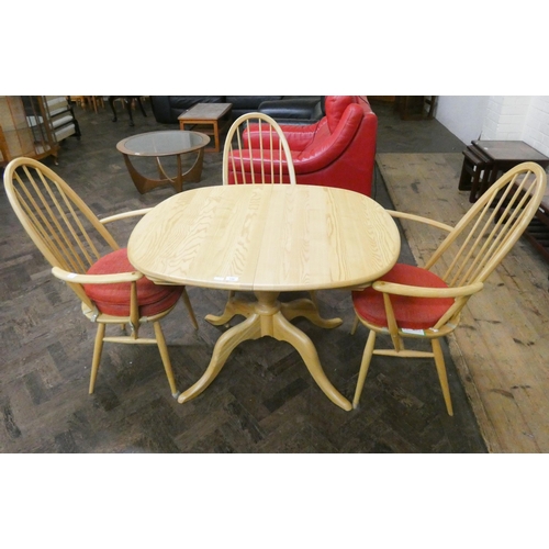 136 - A modern Ercol blonde elm extending dining table with fold away centre leaf together with a pair of ... 