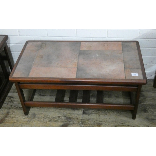 205 - A matching long teak coffee table with brown tile top and under shelf