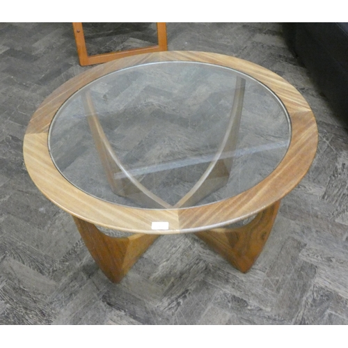 208 - A 1970's circular teak Gplan style coffee table with inset glass top