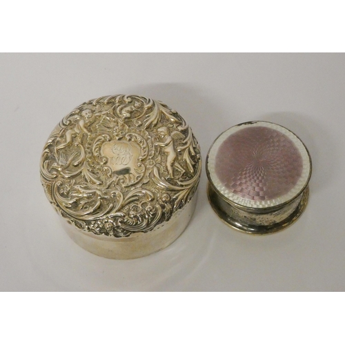 672 - Hallmarked silver circular dressing table jar with embossed lid, 3.3 troy ozs together with a furthe... 