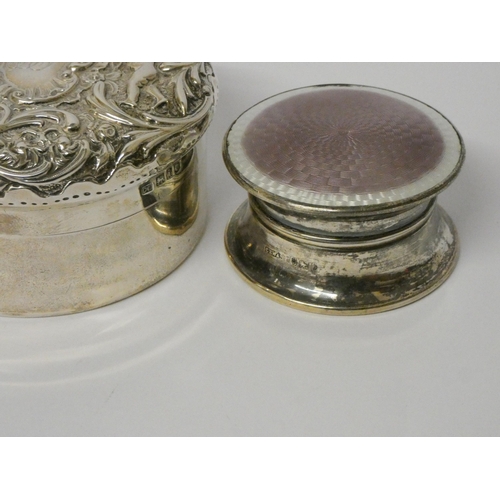 672 - Hallmarked silver circular dressing table jar with embossed lid, 3.3 troy ozs together with a furthe... 