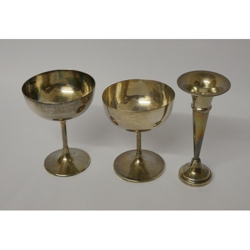 673 - Two silver goblets 5.9 troy ozs and a silver trumpet shaped bud vase on weighted base