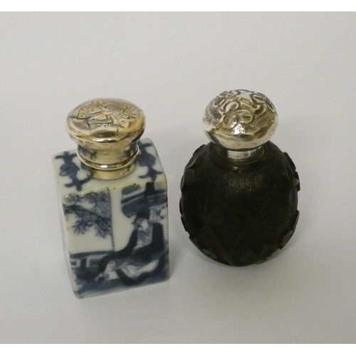 679 - Chinese blue and white porcelain scent bottle and an Irish bog oak scent bottle, both with screw on ... 