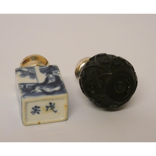 679 - Chinese blue and white porcelain scent bottle and an Irish bog oak scent bottle, both with screw on ... 