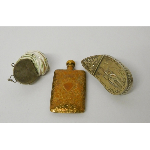 691 - A Victorian gilt metal scent flask with engraved decoration and two white metal mounted shell snuff ... 