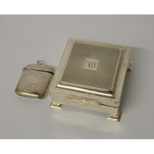 694 - Hallmarked silver square table top cigarette box and a hallmark silver Vesta, cigarette box 9cms acr... 