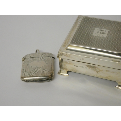 694 - Hallmarked silver square table top cigarette box and a hallmark silver Vesta, cigarette box 9cms acr... 