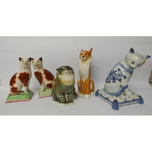 454 - Russian porcelain models of a cat and lynx, pair of Staffordshire cats and a modern Augustus Rex blu... 