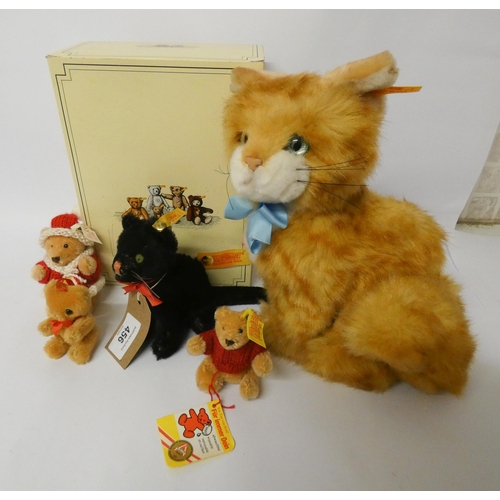 456 - Steiff Tapsy ginger cat with box, Steiff black cat with green glass eyes, two miniature Steiff joint... 