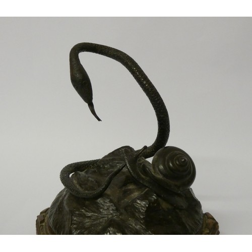 293 - A bronze of a snake and a snail on a hexagonal wooden base, approx 15cms high