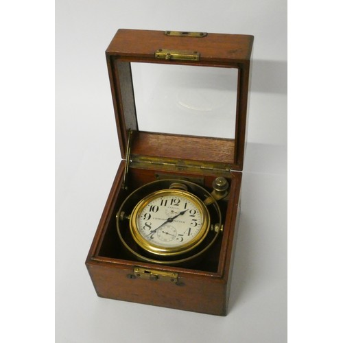 294 - An Eight Day Gimbal Deck Watch, signed Zenith, Chronometer, 20th century, three tier case, silvered ... 