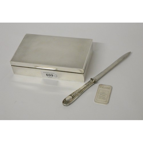 699 - A silver cigarette box, Birmingham 1959, silver 1oz ingot and a French white metal paper knife