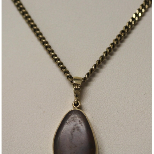 575 - An Australian boulder opal pendant, on  diamond set 14k gold setting,  on a 9ct yellow gold chain. C... 