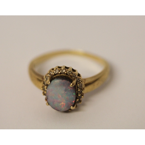 579 - Australian boulder opal and diamond oval cluster ring, on 14k yellow gold band, ring size T, weight ... 