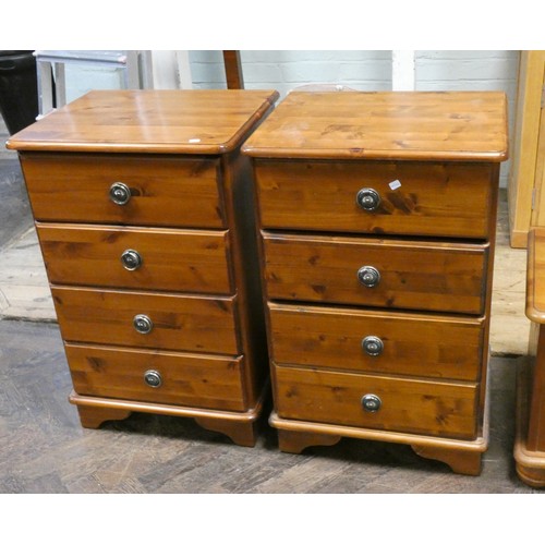 152 - A pair of modern pine four drawer bedside chests