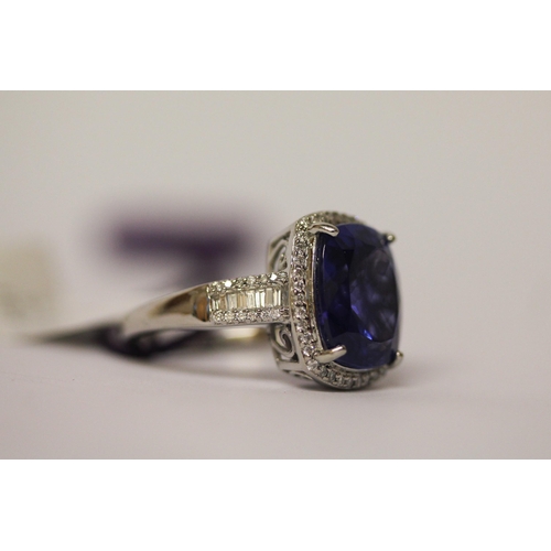 548 - Rhapsody Tanzanite and diamond ring, the 5.9 carat tanzanite surrounded by brilliant cut diamonds on... 