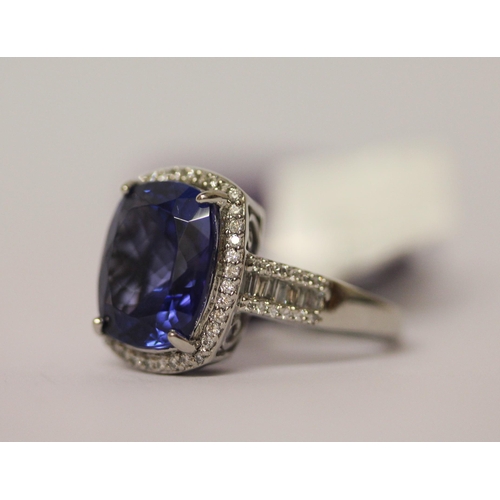 548 - Rhapsody Tanzanite and diamond ring, the 5.9 carat tanzanite surrounded by brilliant cut diamonds on... 