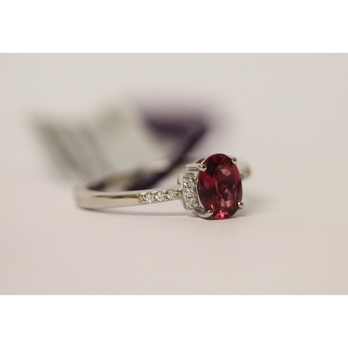 628 - Platinum diamond and rubellite oval cluster ring, as new with certificate, box and tags. Ring Size R... 