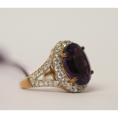 634 - Large amethyst and zircon dress ring, on 9ct gold shank, as new with box and tags. Ring Size L. weig... 