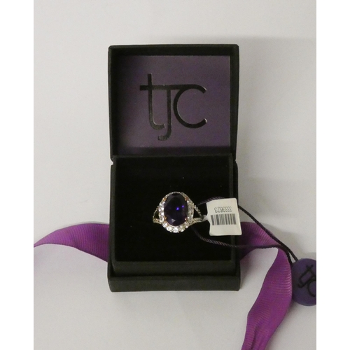 634 - Large amethyst and zircon dress ring, on 9ct gold shank, as new with box and tags. Ring Size L. weig... 