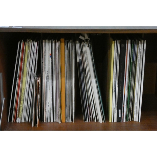 139 - A large quantity of long playing vinyl records and a walnut record cabinet