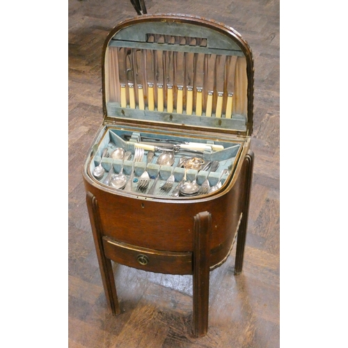 153 - An oak bow front work box/canteen of cutlery