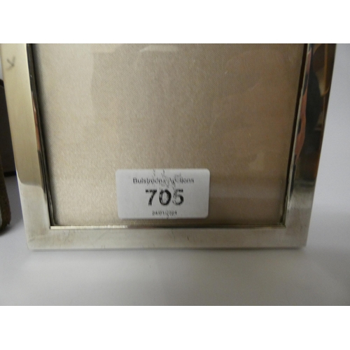 701 - Two rectangular silver photo frames, with engraved decoration, Tallest measures 18cms