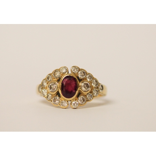 524 - A ruby and diamond cluster panel ring, set with an oval ruby surrounded by brilliant cut diamonds, 1... 