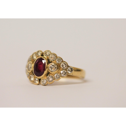 524 - A ruby and diamond cluster panel ring, set with an oval ruby surrounded by brilliant cut diamonds, 1... 