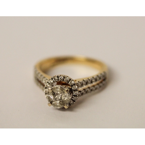 530 - A modern diamond ring, the halo set brilliant cut diamond on diamond shoulders, all in 18ct yellow g... 