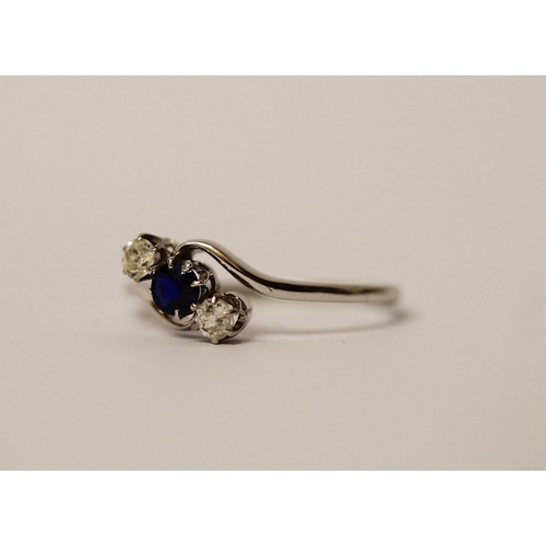 545 - A vintage sapphire and diamond three stone ring, in a twist design, on platinum band, hallmarks worn... 