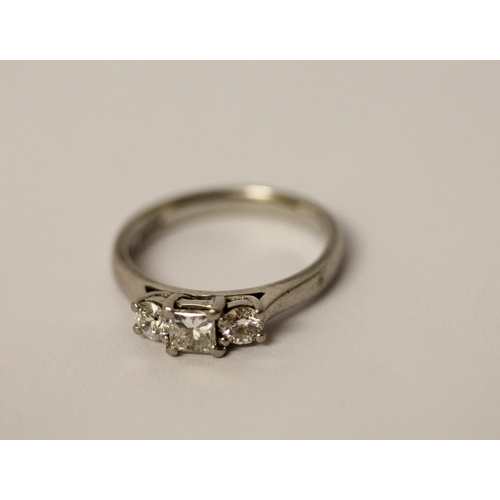 554 - A platinum and diamond three stone ring, hallmarked, ring size K, weight 4.6g