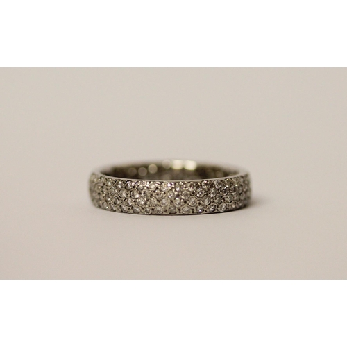 555 - A platinum pave diamond eternity ring or wedding band, fully diamond set, hallmarked, ring size J, w... 