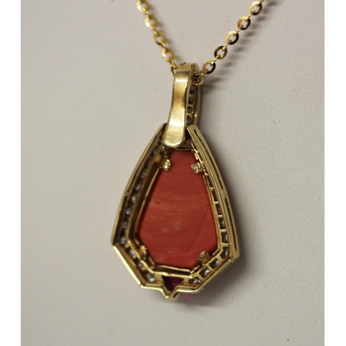 559 - A coral, ruby and diamond pendant, the central coral surrounded by brilliant cut diamonds with ruby ... 