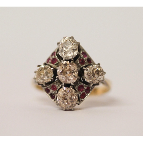 568 - An Art Deco ring, set with five old cut diamonds in a quatrefoil motif with small rubies between, in... 