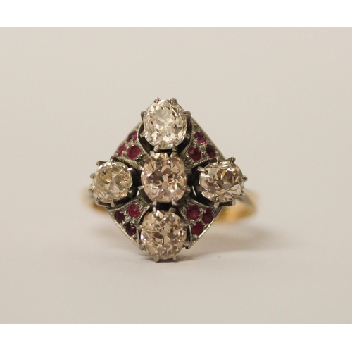 568 - An Art Deco ring, set with five old cut diamonds in a quatrefoil motif with small rubies between, in... 