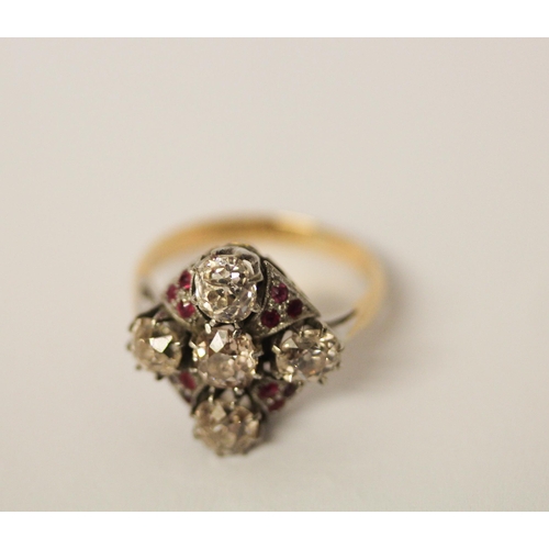 568 - An Art Deco ring, set with five old cut diamonds in a quatrefoil motif with small rubies between, in... 