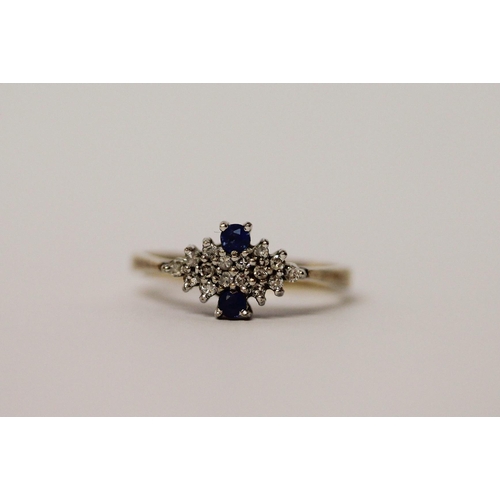 580 - A sapphire and diamond panel cluster ring, on hallmarked 9ct gold band. Ring size N, weight 2.6g