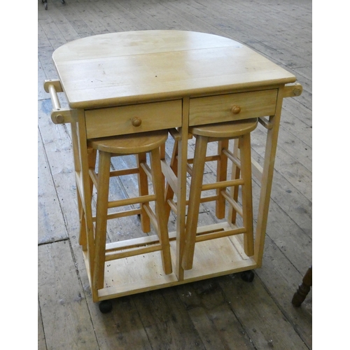 125 - A modern beech drop leaf kitchen table with a pair of matching high stools