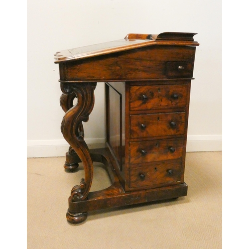 166 - A Victorian walnut davenport with galleried top, 22